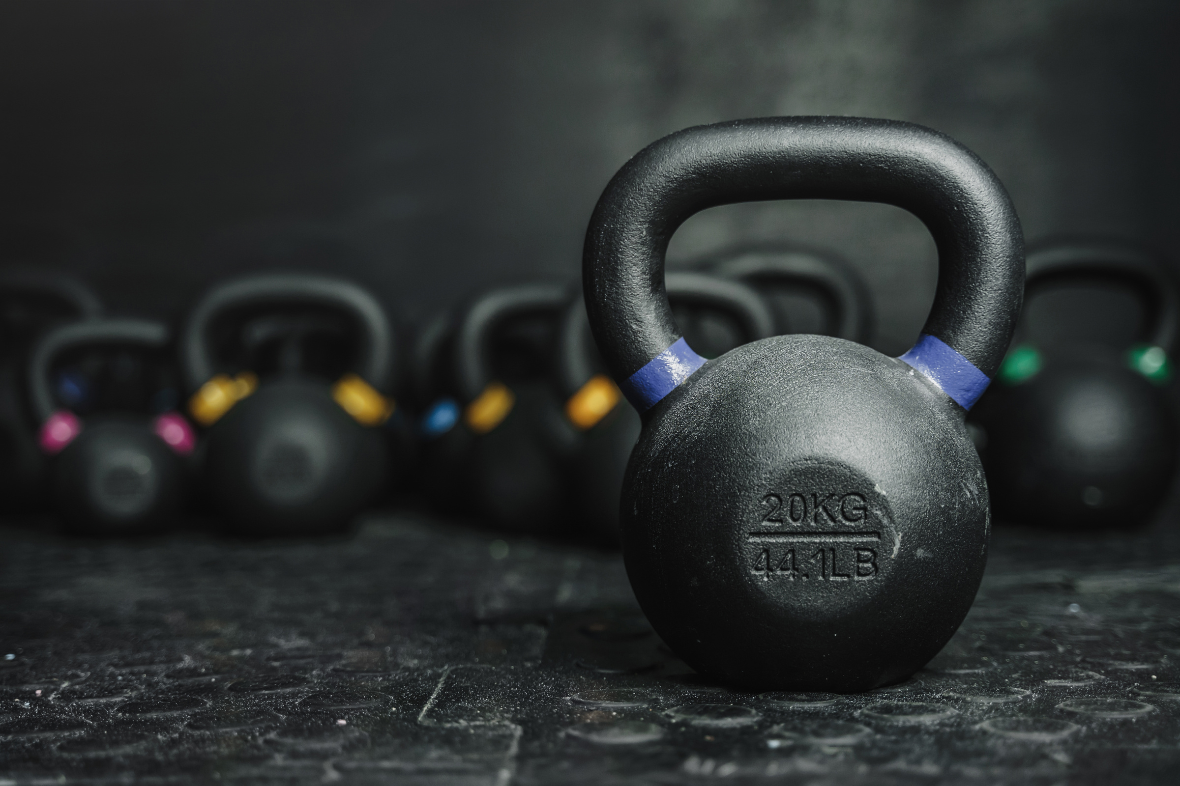 Kettlebells on dark backgroud at the gym gym